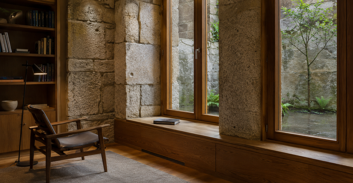 Renovated house in Porto with granite walls and wooden window frames