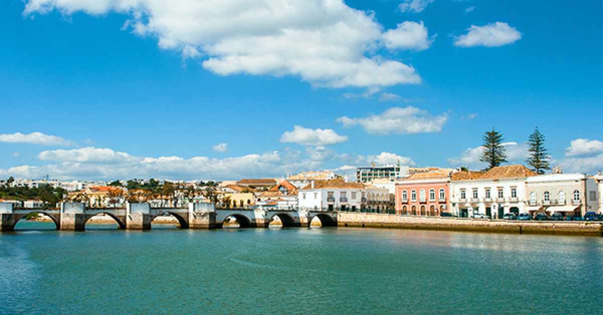What makes Tavira a must-see destination in the Algarve?